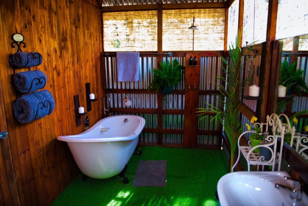 Cabin 1 exterior with wooden deck and river view